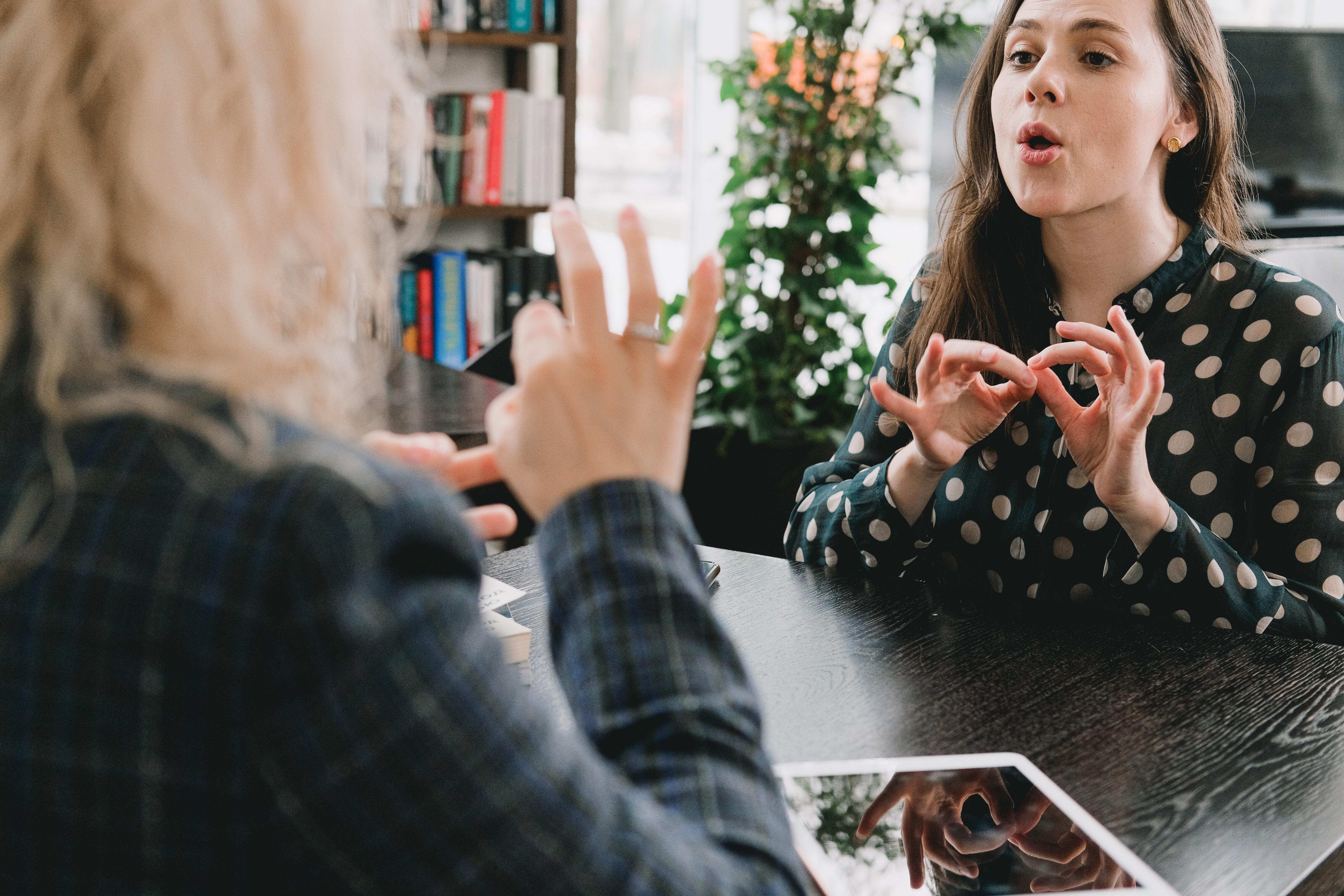 Friends communicating in sign language